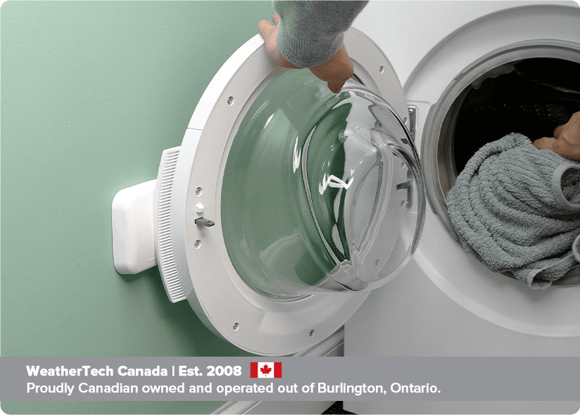 A washing machine door open and hitting a wall A washing machine door open and hitting a wall